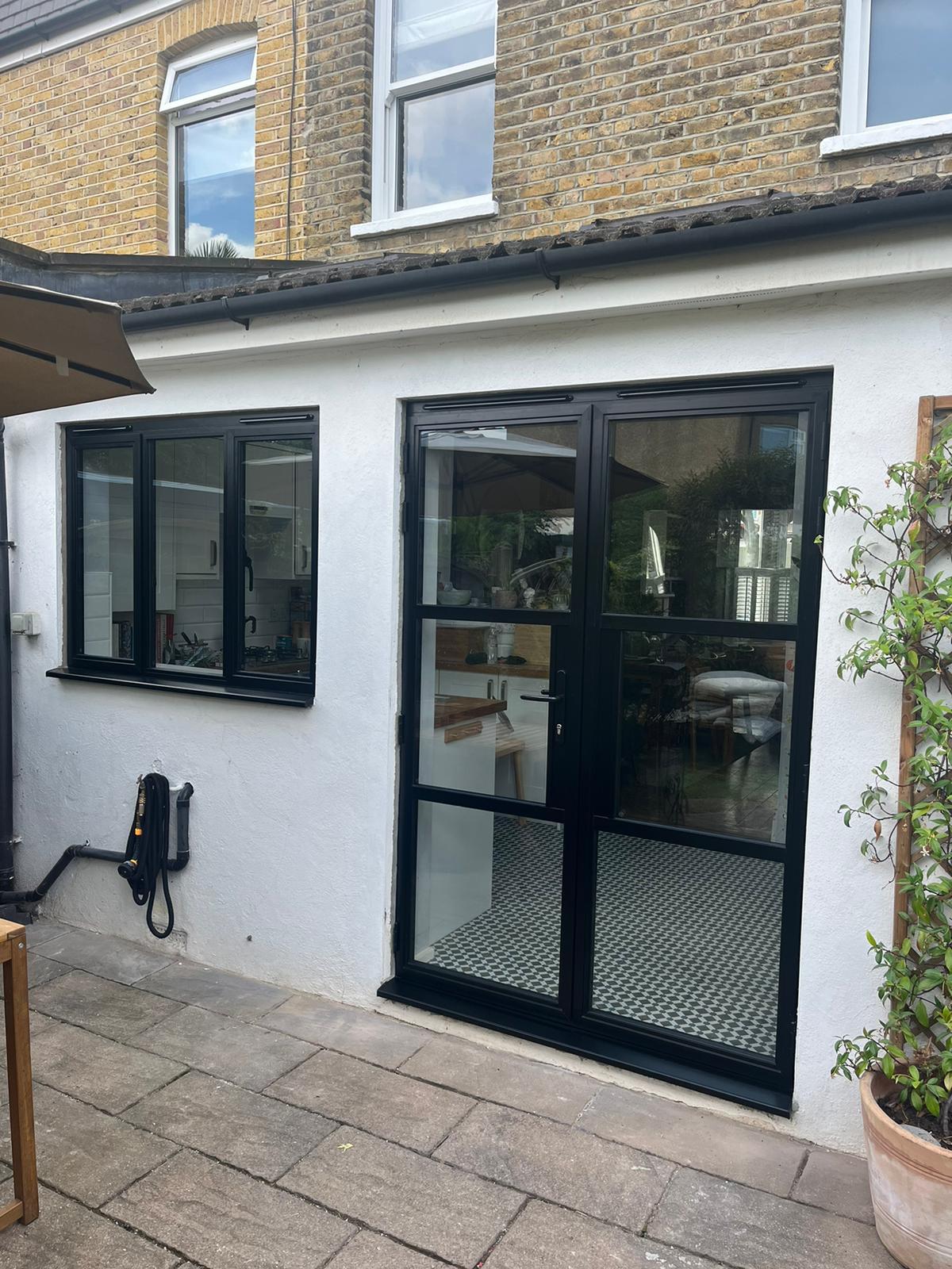 Steel-look French doors with matching kitchen window