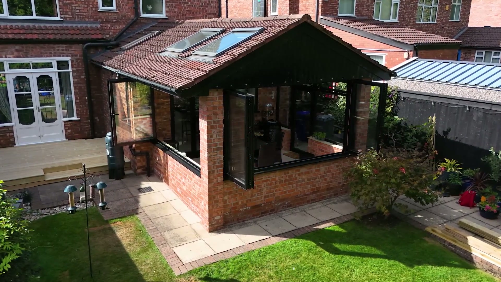 Return elevation, five-panel bifold open to the garden