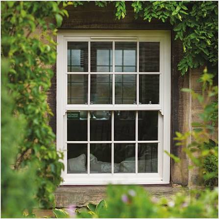 Vertical sliding sash window in a stone cottage elevation