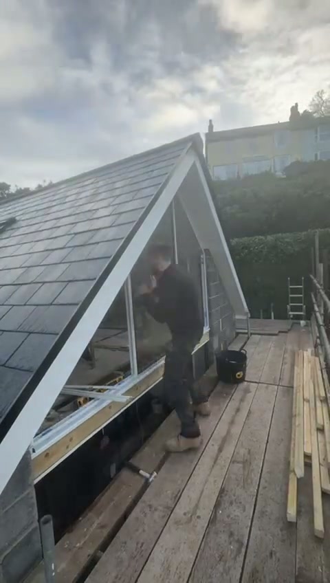 The screen is offered up dry into the opening before a single fixing goes in — confirming that what the survey recorded is true on site.