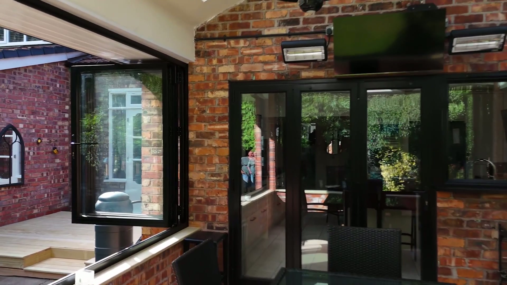 Slim sightlines and matching cills in RAL 9005 jet black — Sliding Doors by Windows in the Lakes