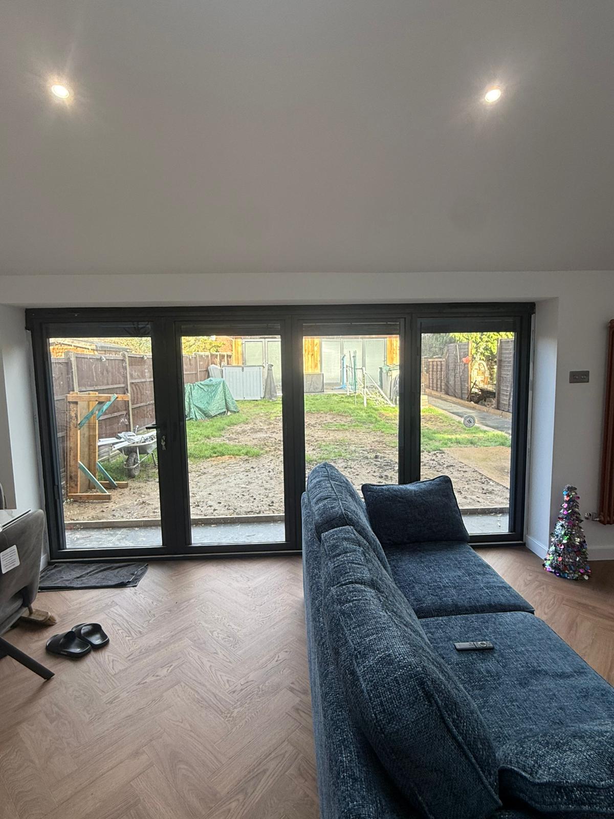 Bifold doors seen from the living room, garden beyond
