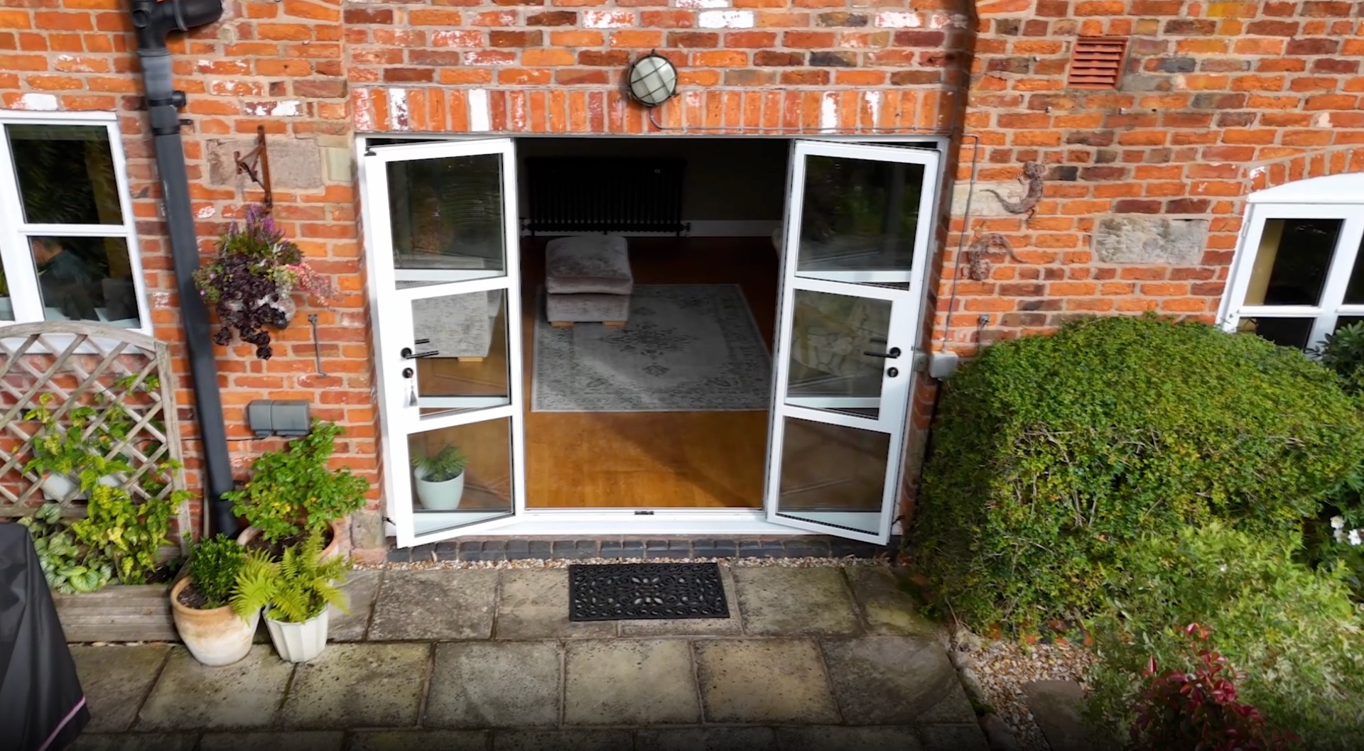 White French doors opening to a barn courtyard