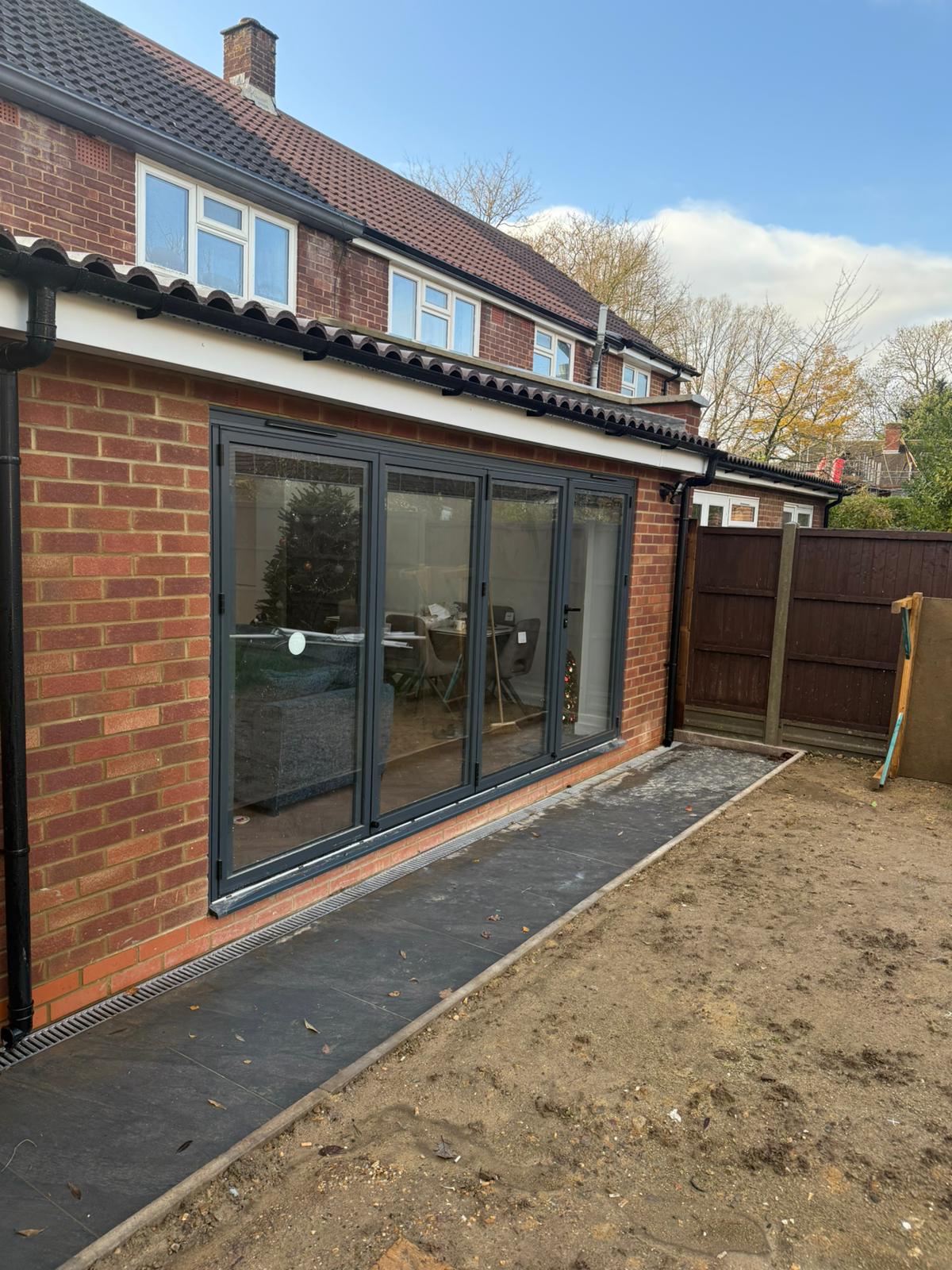 Anthracite Bifolding Doors, Brick Extension, installed in North West, July 2026
