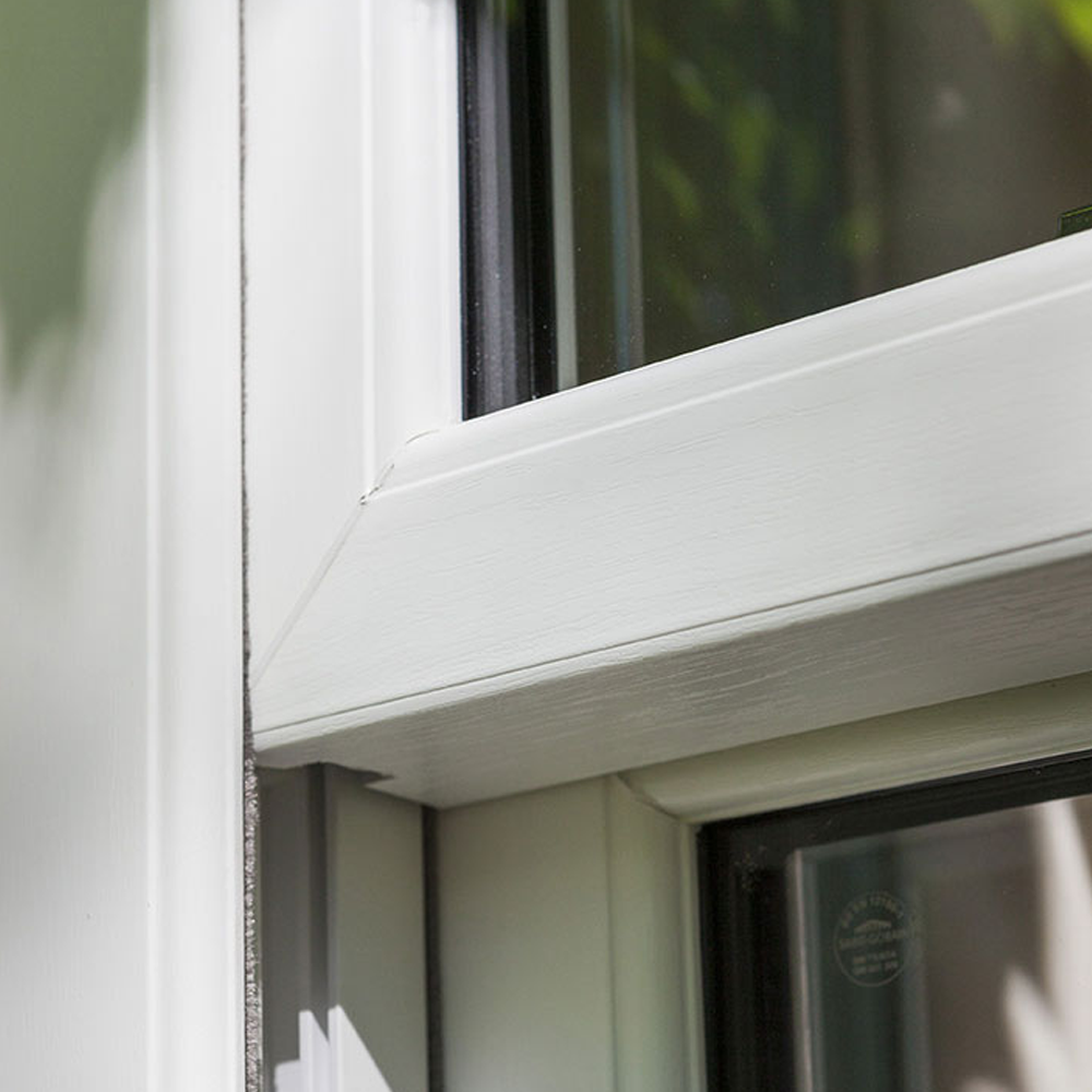 Woodgrain sash profile and sloped external sill detail
