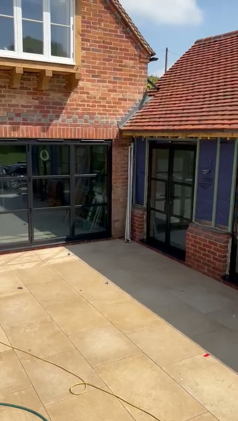 The glazed run turning the corner onto the sandstone terrace